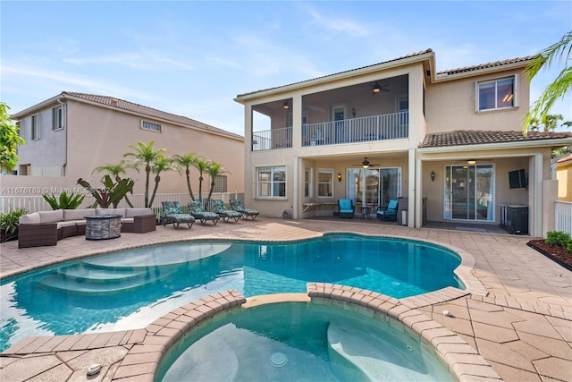 view of swimming pool with an in ground hot tub, ceiling fan, a patio area, and an outdoor hangout area