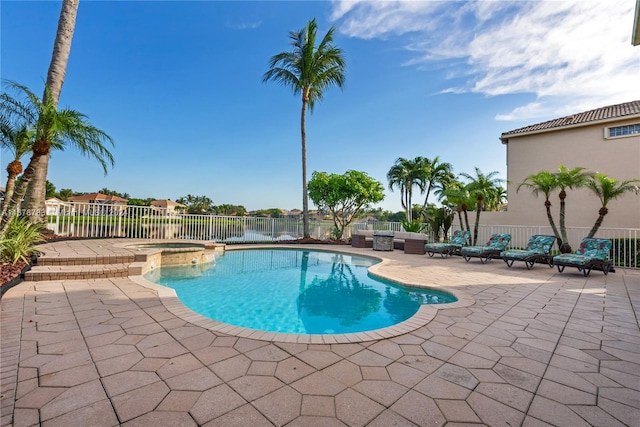 view of pool with an in ground hot tub and a patio area