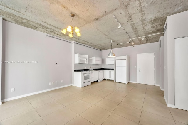 690 SW 1st Ct Unit 1730, Miami, FL 33130 - kitchen with white appliances, white cabinetry, dark countertops, decorative light fixtures, and a chandelier