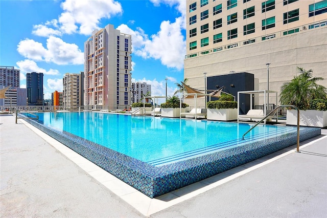 view of swimming pool featuring a patio area