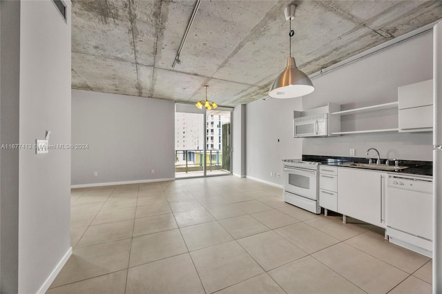 690 SW 1st Ct Unit 1730, Miami, FL 33130 - kitchen with white appliances, a sink, open shelves, baseboards, and white cabinetry