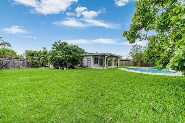 view of front of property featuring a garage and a front lawn