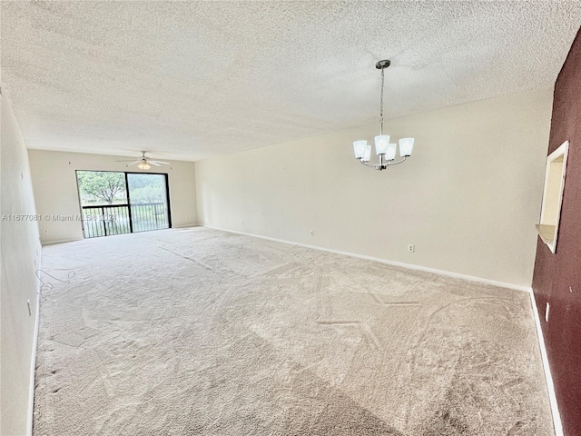 empty room featuring carpet floors, a textured ceiling, and ceiling fan with notable chandelier