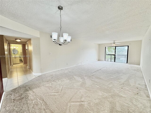 unfurnished living room with light carpet, a textured ceiling, and ceiling fan