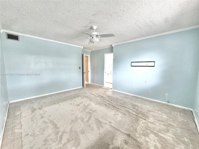 carpeted empty room with crown molding, a textured ceiling, and ceiling fan