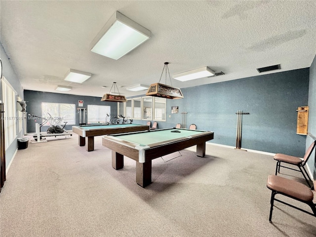 rec room featuring carpet, pool table, and a textured ceiling