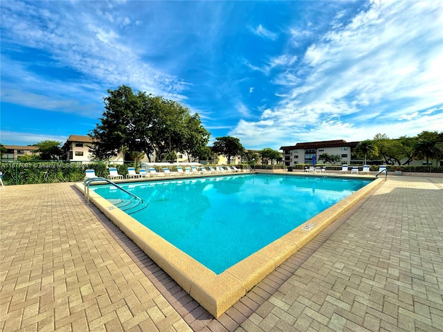 view of swimming pool featuring a patio area