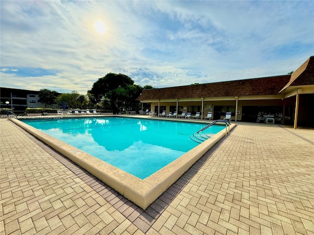 view of swimming pool featuring a patio