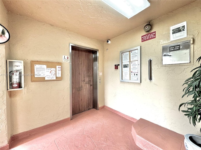 hallway featuring tile patterned floors