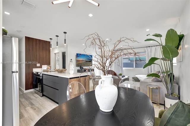 dining area with light wood-type flooring