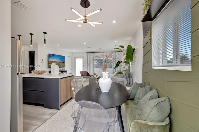 dining area featuring a notable chandelier