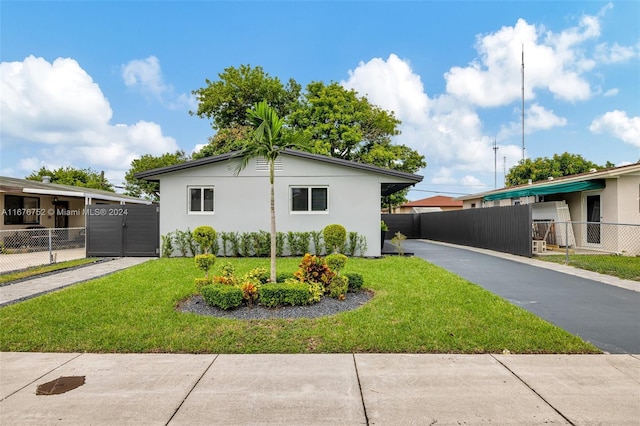 view of side of property with a yard