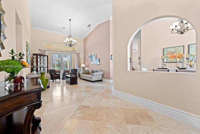 hallway featuring crown molding and a high ceiling