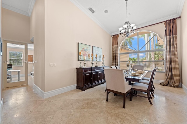 dining area featuring crown molding, a notable chandelier, a towering ceiling, and plenty of natural light