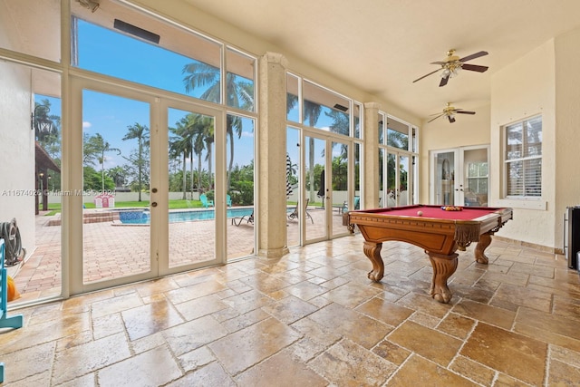 rec room featuring french doors, plenty of natural light, and ceiling fan