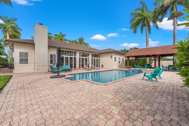 view of swimming pool with a patio area