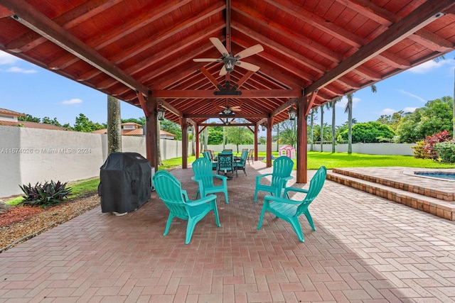 view of patio featuring a gazebo, area for grilling, and ceiling fan