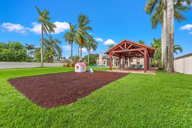 3601 SW 129th Ave, Miami, FL 33175 - fenced backyard featuring area for grilling, a ceiling fan, a gazebo, a patio, and outdoor dining space