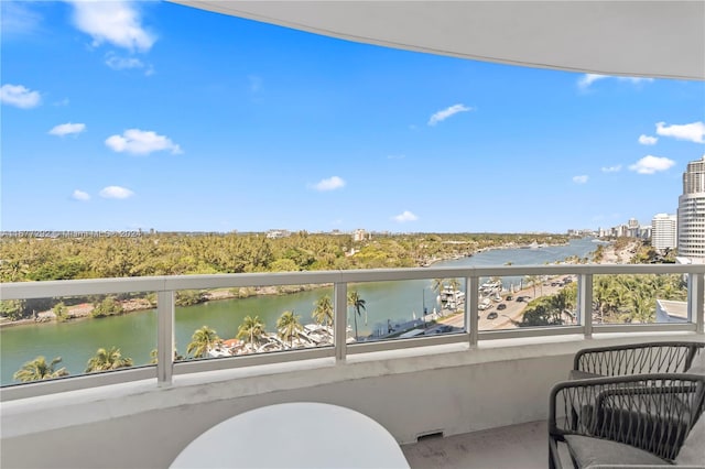 balcony featuring a water view