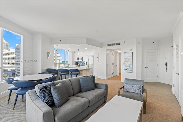 4401 Collins Ave Unit 915, Miami Beach, FL 33140 - living room with light carpet, baseboards, ornamental molding, and a city view