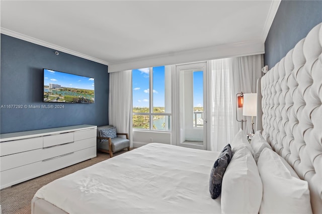 carpeted bedroom with ornamental molding