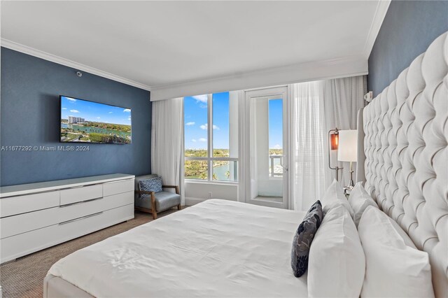 4401 Collins Ave Unit 915, Miami Beach, FL 33140 - bedroom with ornamental molding and access to exterior