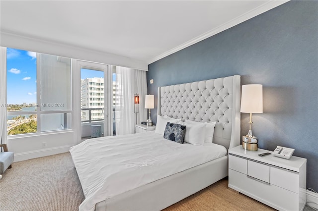 bedroom with ornamental molding and light carpet