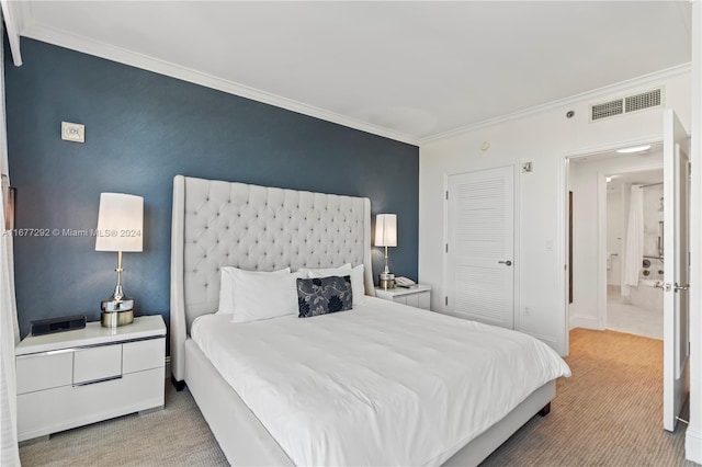 bedroom with ornamental molding, carpet floors, and a closet