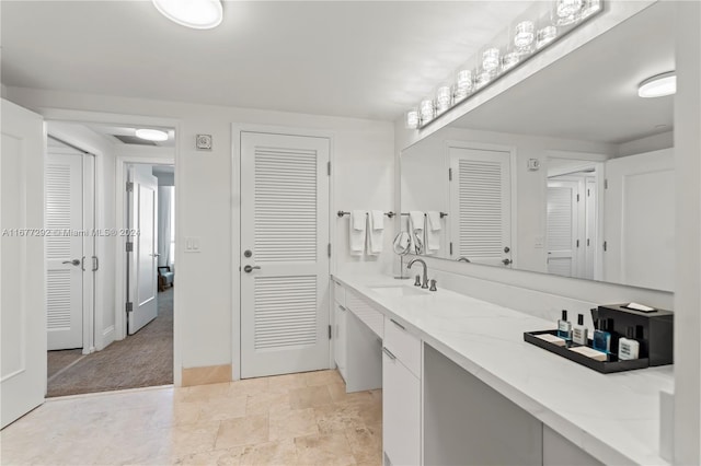 4401 Collins Ave Unit 915, Miami Beach, FL 33140 - bathroom featuring a closet, vanity, and baseboards