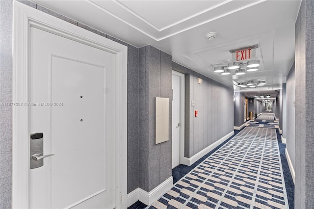 4401 Collins Ave Unit 915, Miami Beach, FL 33140 - corridor featuring baseboards and a tray ceiling