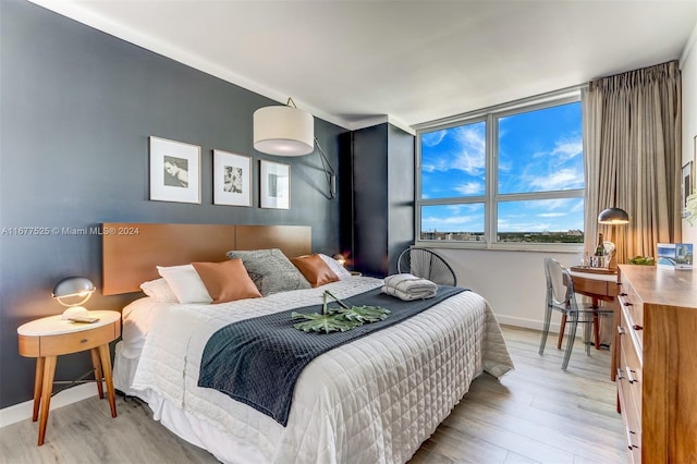 bedroom featuring light wood-type flooring