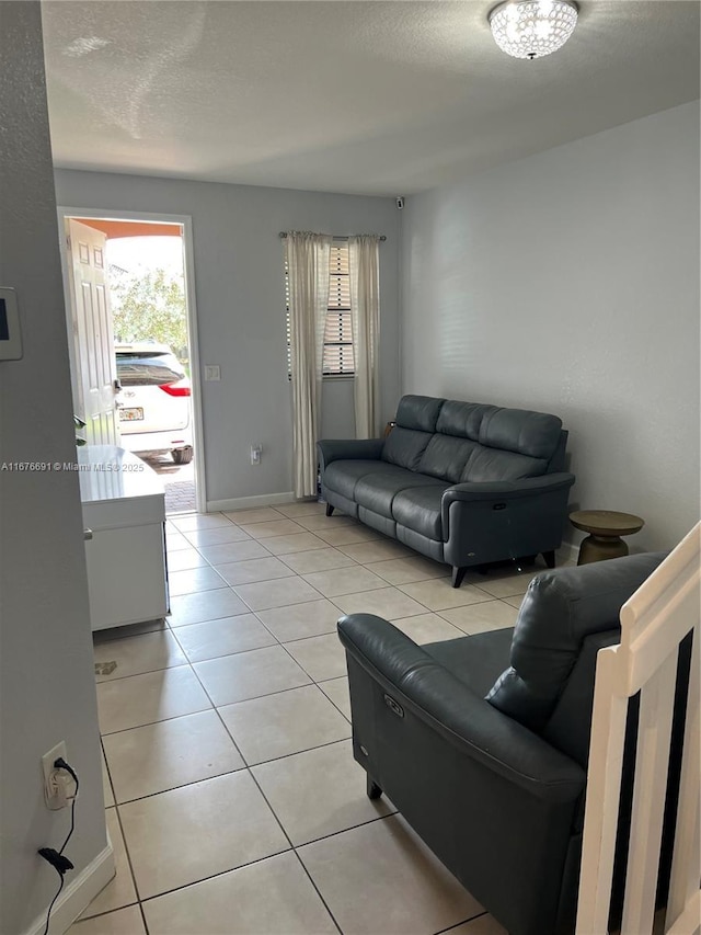 152 SE 37th Ter Unit 152, Homestead, FL 33033 - living area with light tile patterned floors, plenty of natural light, and a textured ceiling