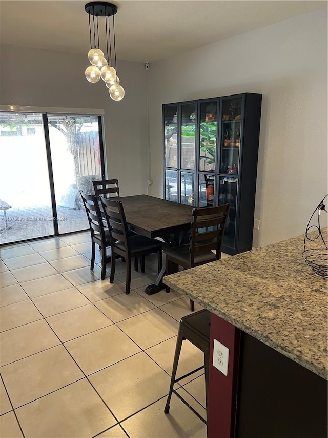 dining area with light tile patterned floors