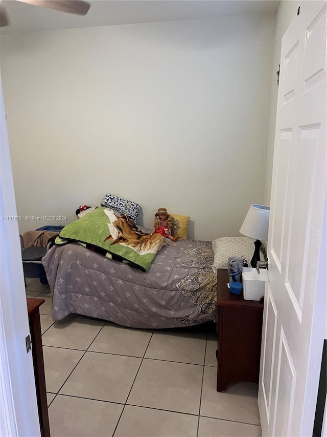 bedroom featuring ceiling fan and light tile patterned floors