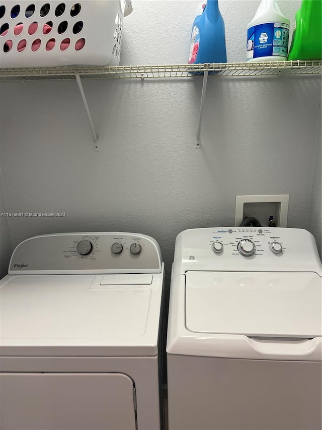 laundry area featuring washing machine and clothes dryer