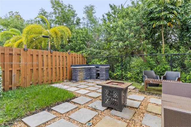 view of patio / terrace featuring a fire pit