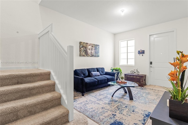 living room featuring stairway