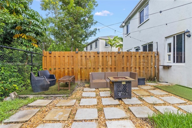 view of patio / terrace featuring fence and an outdoor fire pit