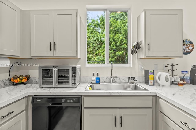 kitchen featuring dishwasher, a toaster, and a sink