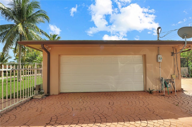 garage with a lawn