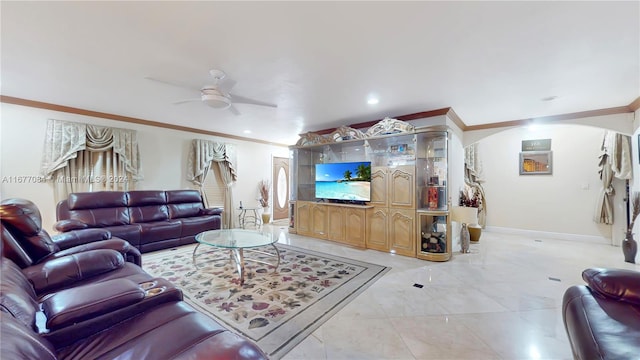 living room with ornamental molding and ceiling fan