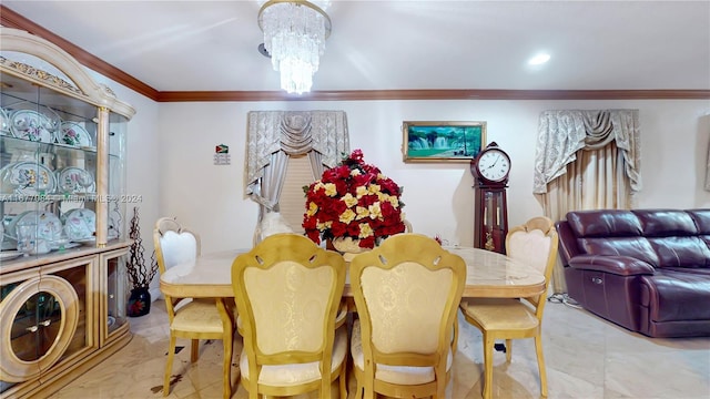 dining area featuring crown molding and an inviting chandelier