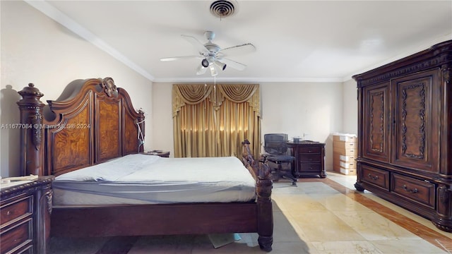 bedroom with ornamental molding and ceiling fan