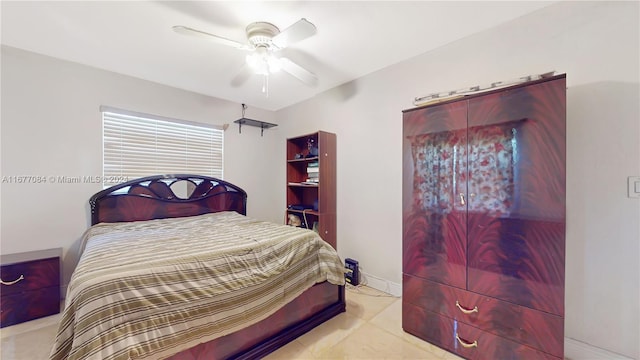 tiled bedroom with ceiling fan