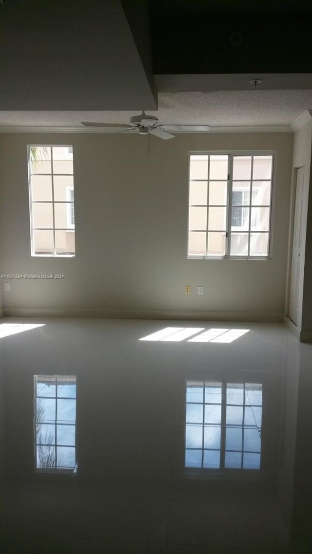 spare room featuring ceiling fan