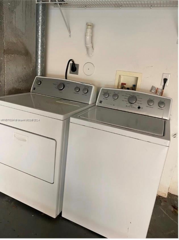 laundry room featuring separate washer and dryer