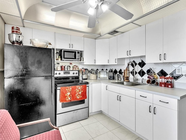 kitchen featuring backsplash, ceiling fan, white cabinetry, sink, and stainless steel appliances