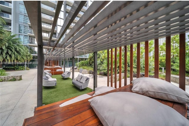 88 SW 7th St Unit 1710, Miami, FL 33130 - wooden deck featuring a pergola and a patio area