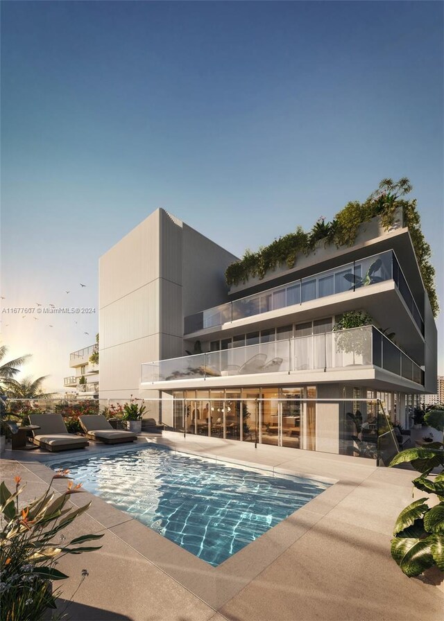 1130 100th St Unit 3B, Bay Harbor Islands, FL 33154 - view of swimming pool with a patio