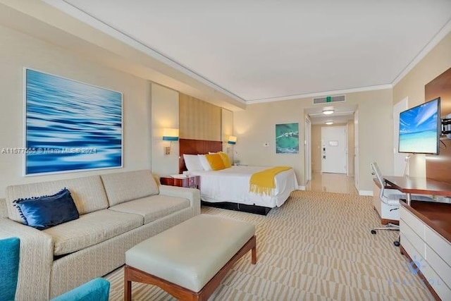 bedroom featuring crown molding and light carpet